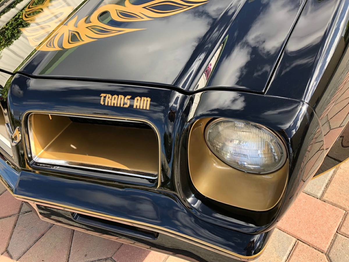 Closeup on the right headlight to display features of the headlight and grill.